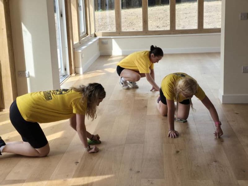 Simply Sorted team members cleaning on a post-builder job